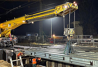 KRC 810 crane lifting an auxiliary bridge